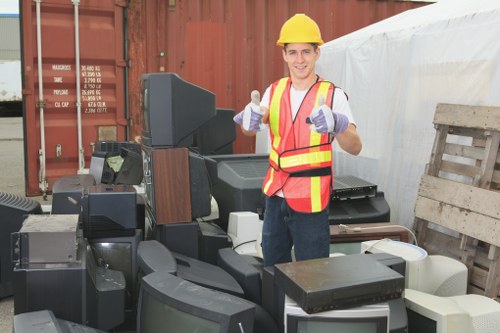 People arranging furniture clearance in a Plaistow home