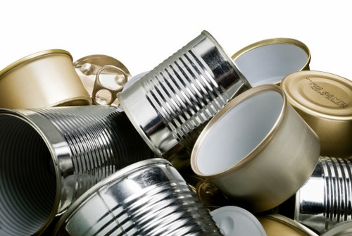 Low-carbon electric van at a local transfer station being loaded with sorted waste